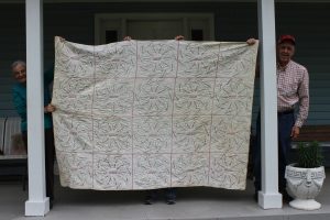 quilt-with-440-names-held-by-angalee-and-rodney-rushing